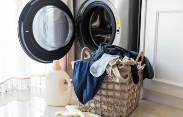 Basket with laundry and washing machine Basket with laundry and washing machine